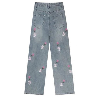 Jeans con ricamo rosa e coniglietto
